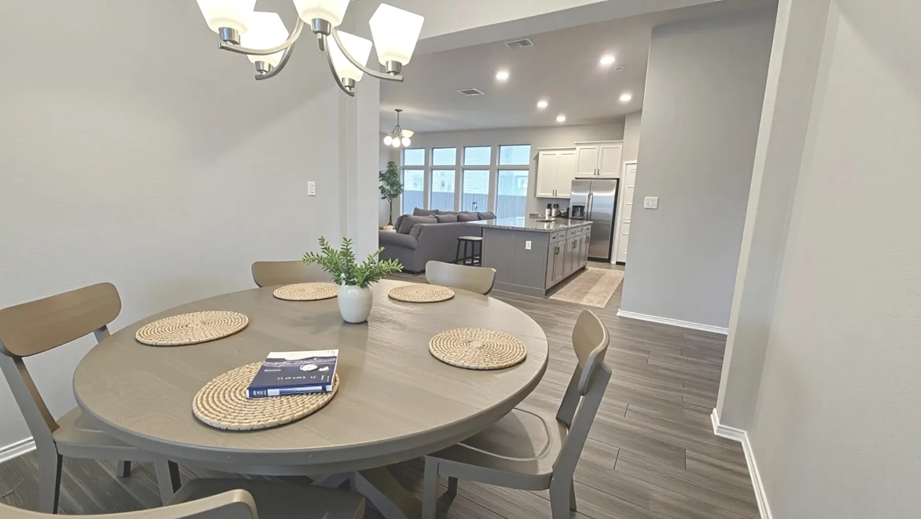 Furnished dining room opening toward the kitchen at Aggie Run