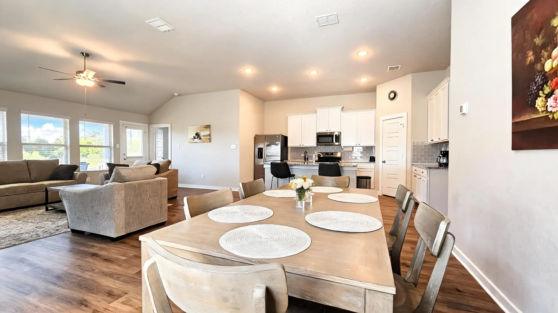 Furnished dining area opening to the kitchen and living room at Beebrush Saddle