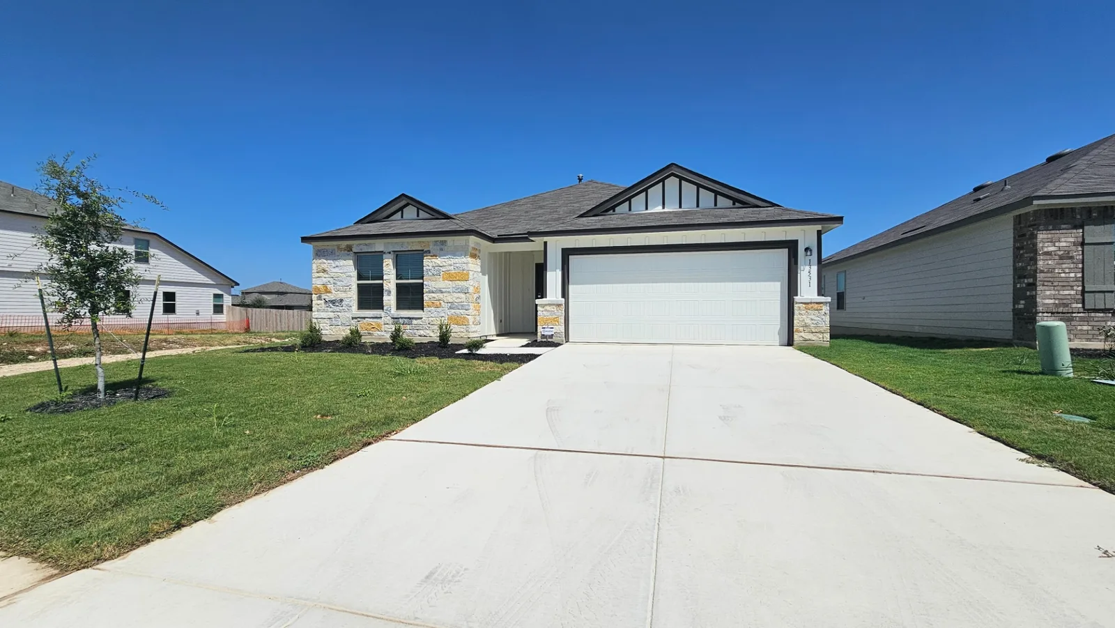 New-construction exterior and two-car garage at the Beebrush Saddle furnished home
