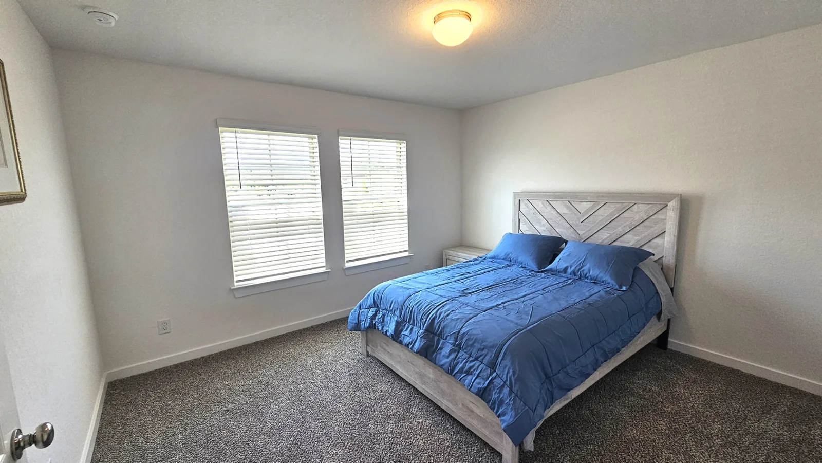 Furnished guest bedroom at the Beebrush Saddle new-build home