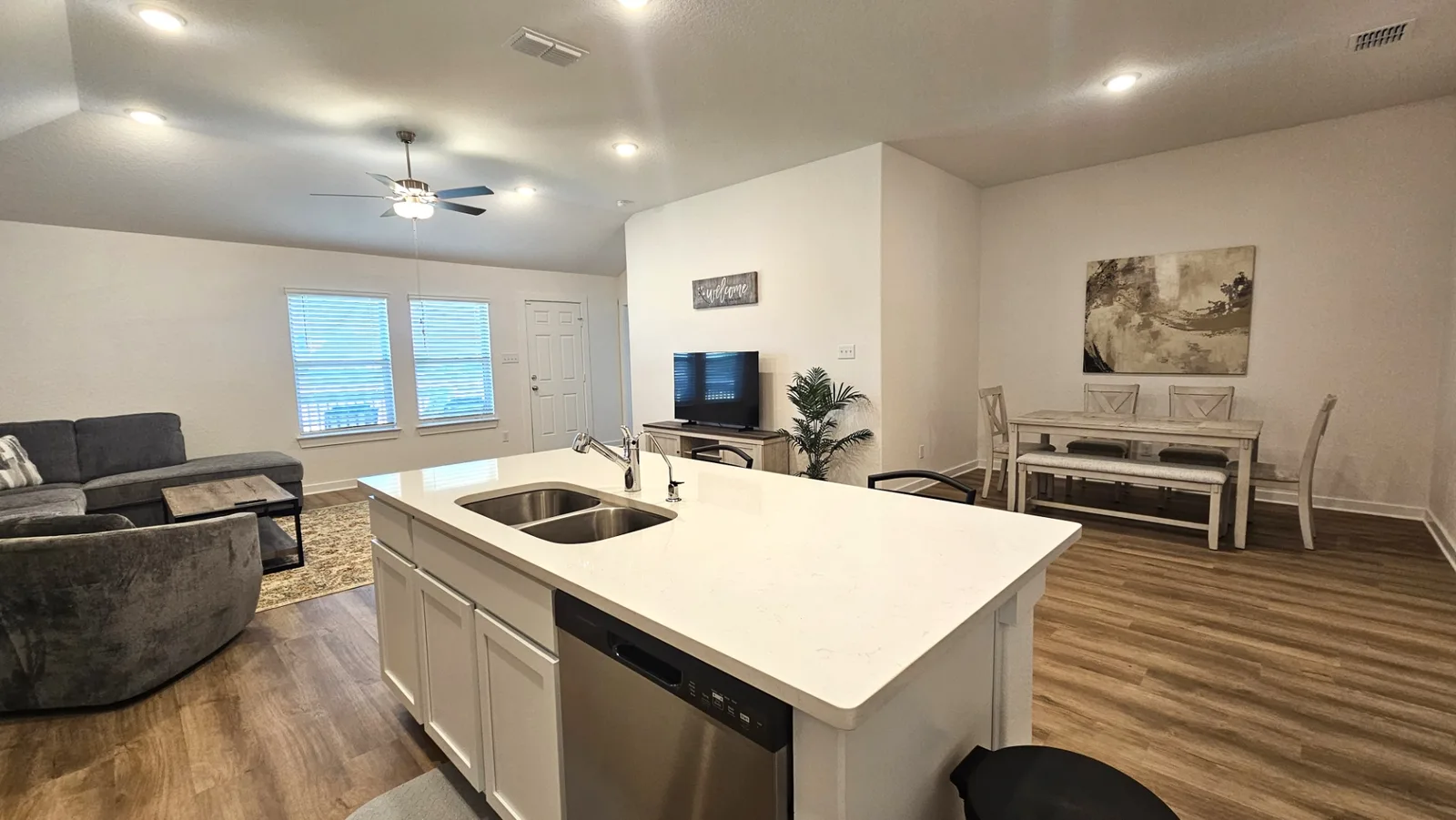 Large kitchen island and open living space at the Beebrush Saddle home