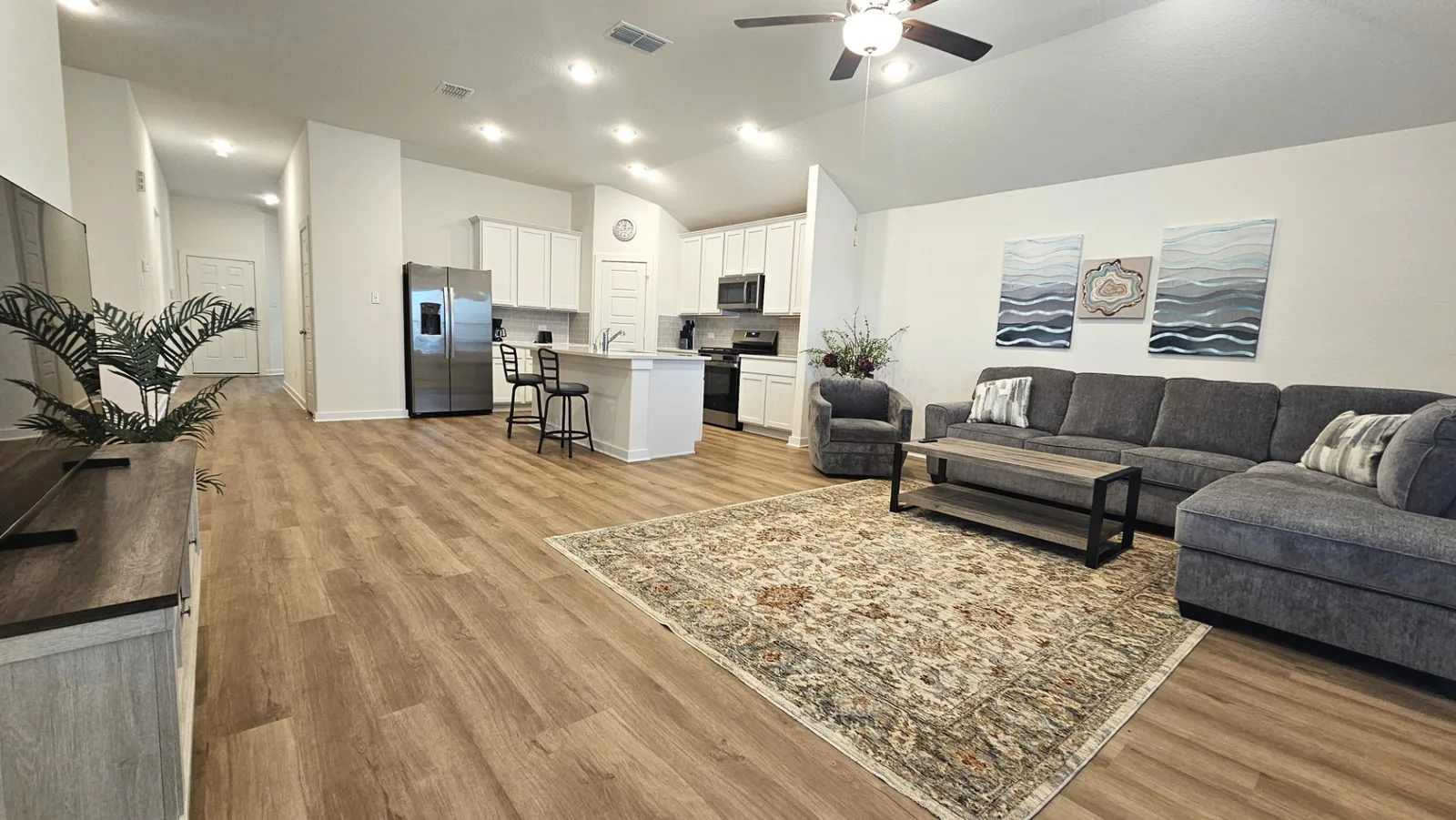 Bright open living room and kitchen at the Beebrush Saddle new-build furnished home
