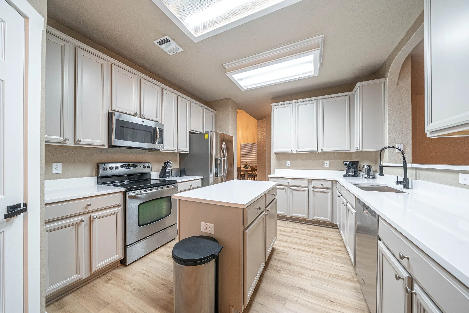 Bright furnished kitchen with island seating at Bright Chase