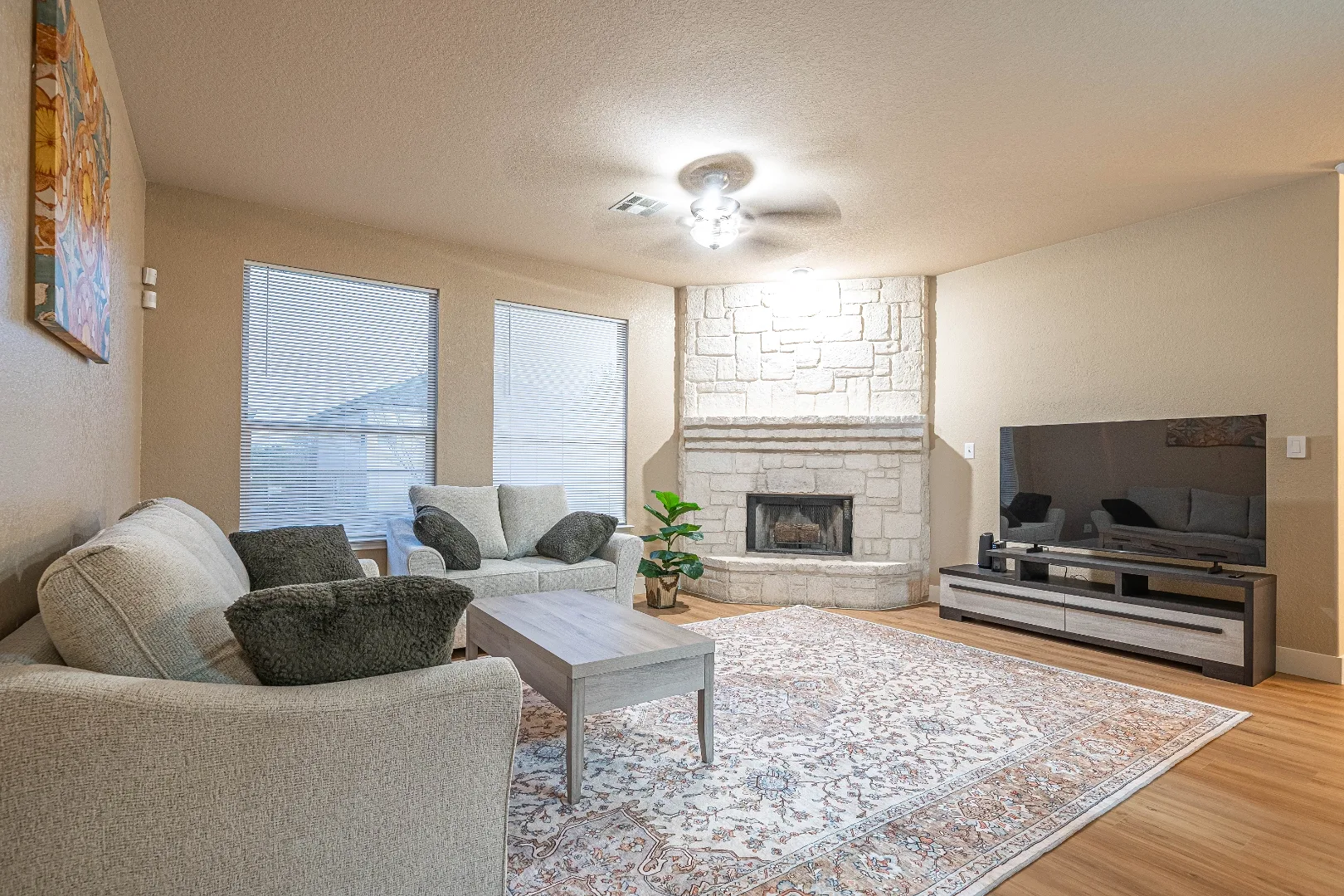 Furnished living room with fireplace at the Bright Chase home