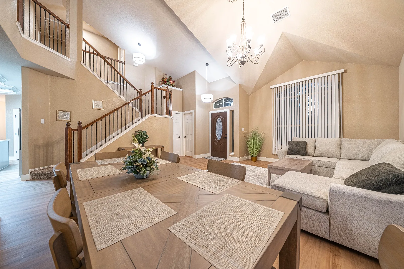 Open furnished living and dining area at Bright Chase