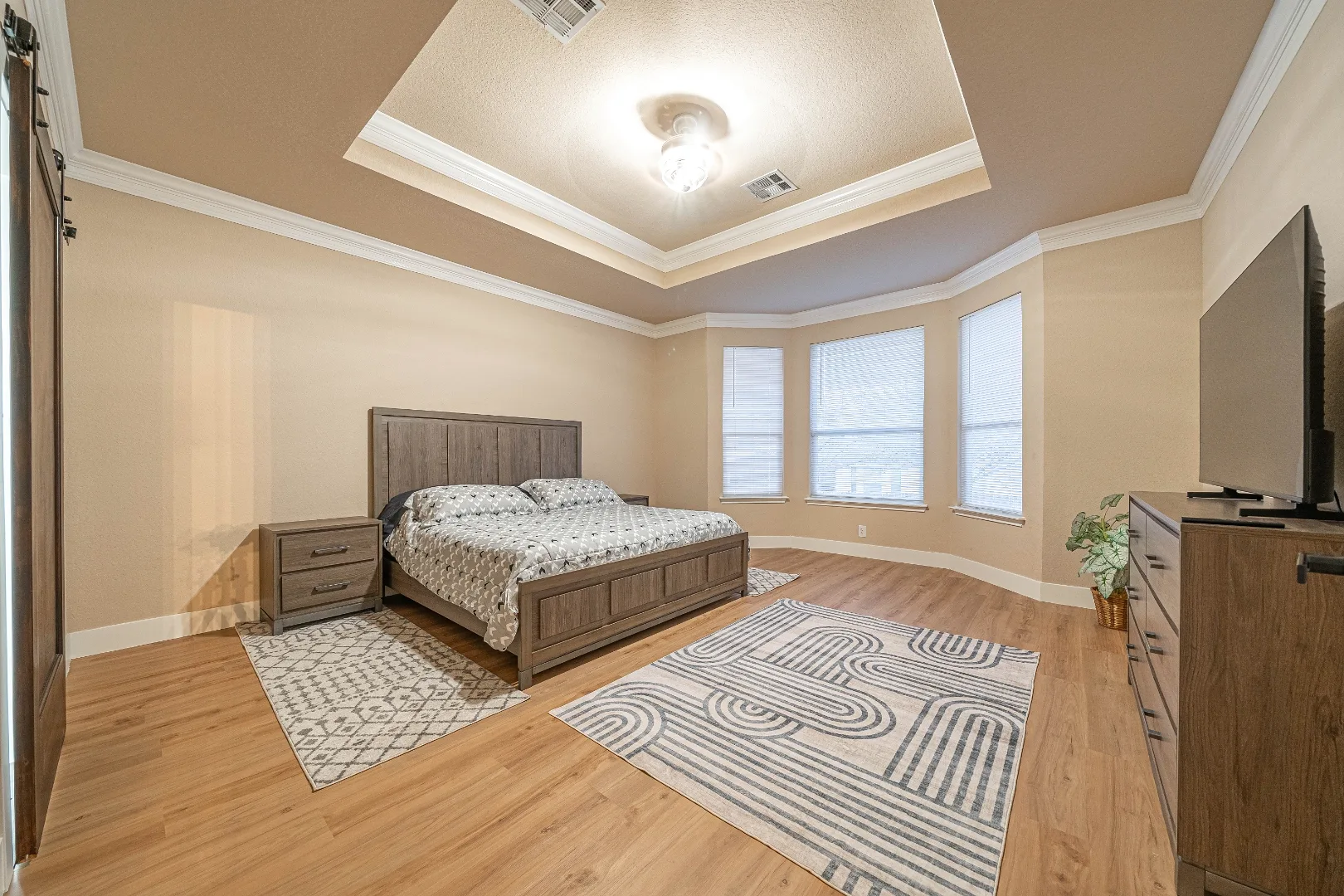 Furnished first-floor primary bedroom at Bright Chase