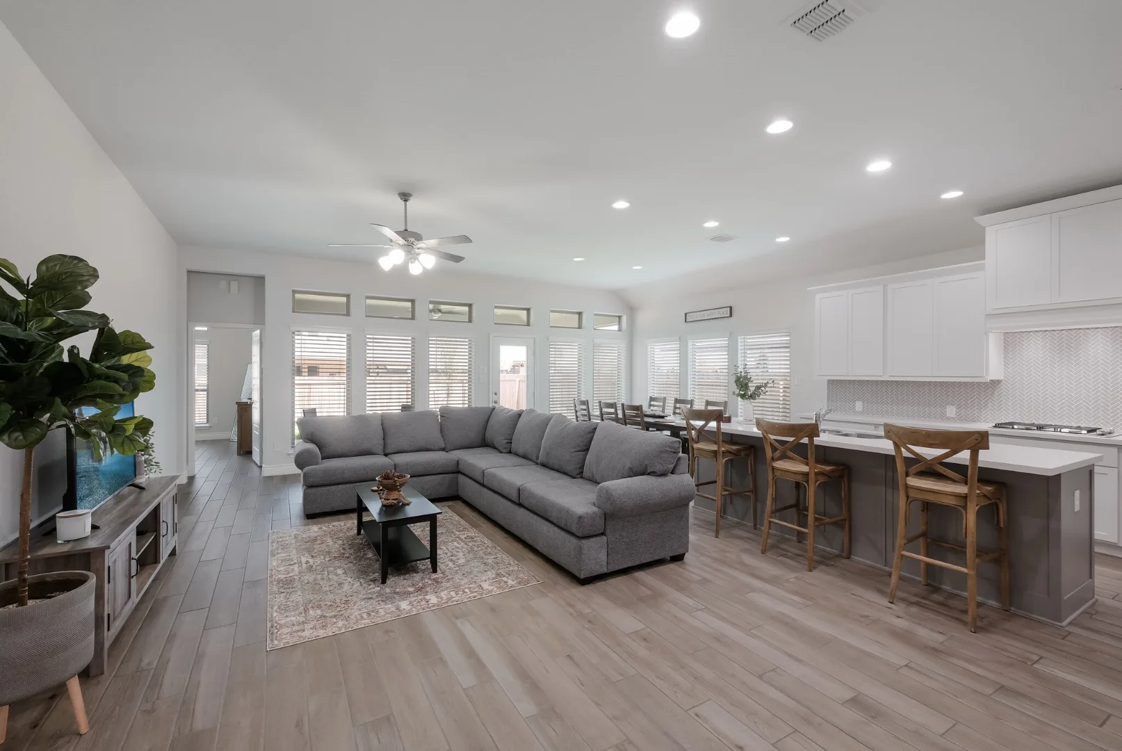 Open furnished living room and kitchen at the Desperado Run home