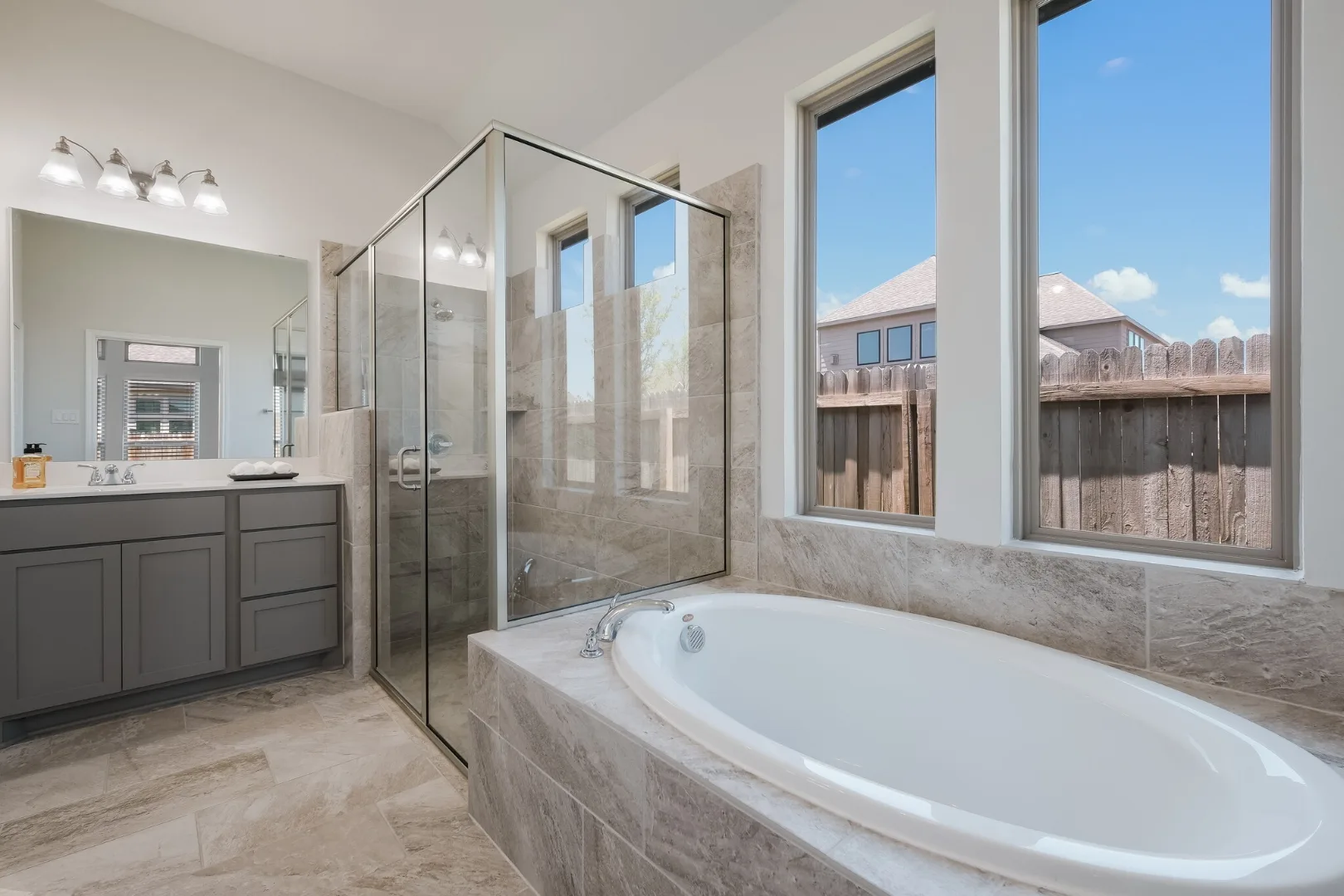 Primary bathroom with soaking tub and glass shower at Desperado Run