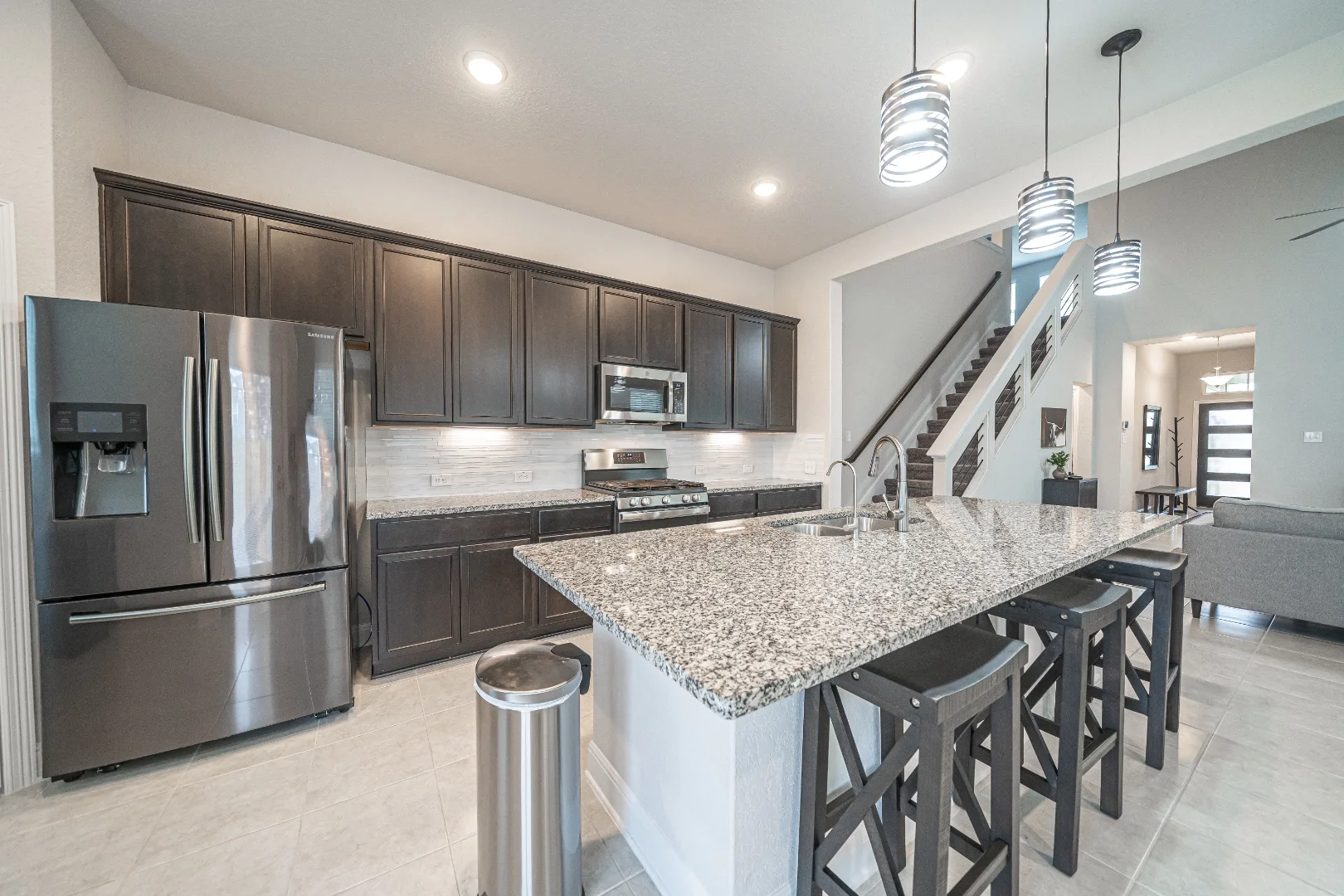 Furnished kitchen with island seating at Locklear Way