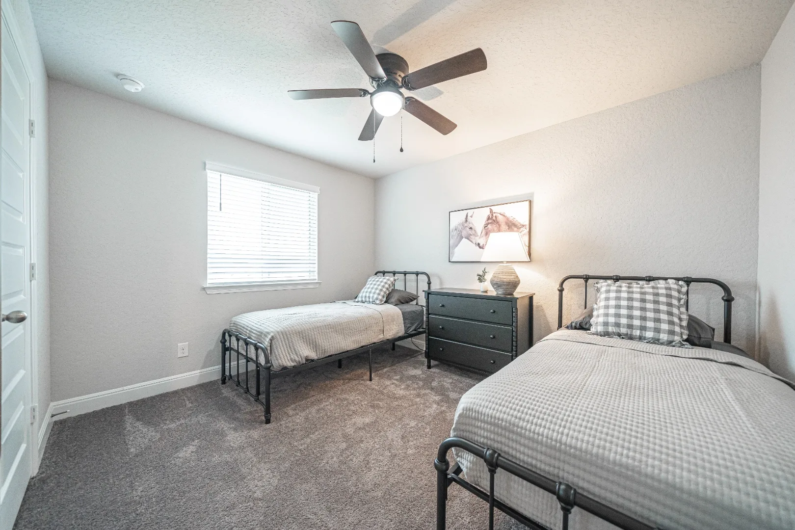 Furnished bedroom with two twin beds at Locklear Way