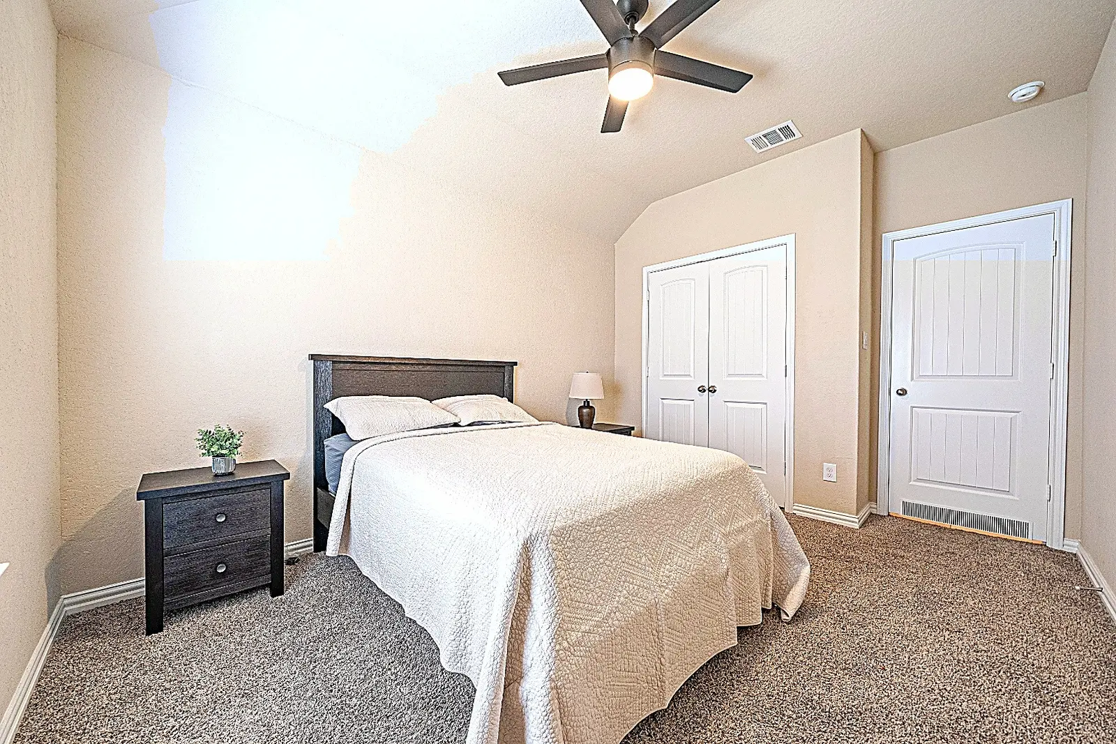 Furnished guest bedroom at Rawhide Way