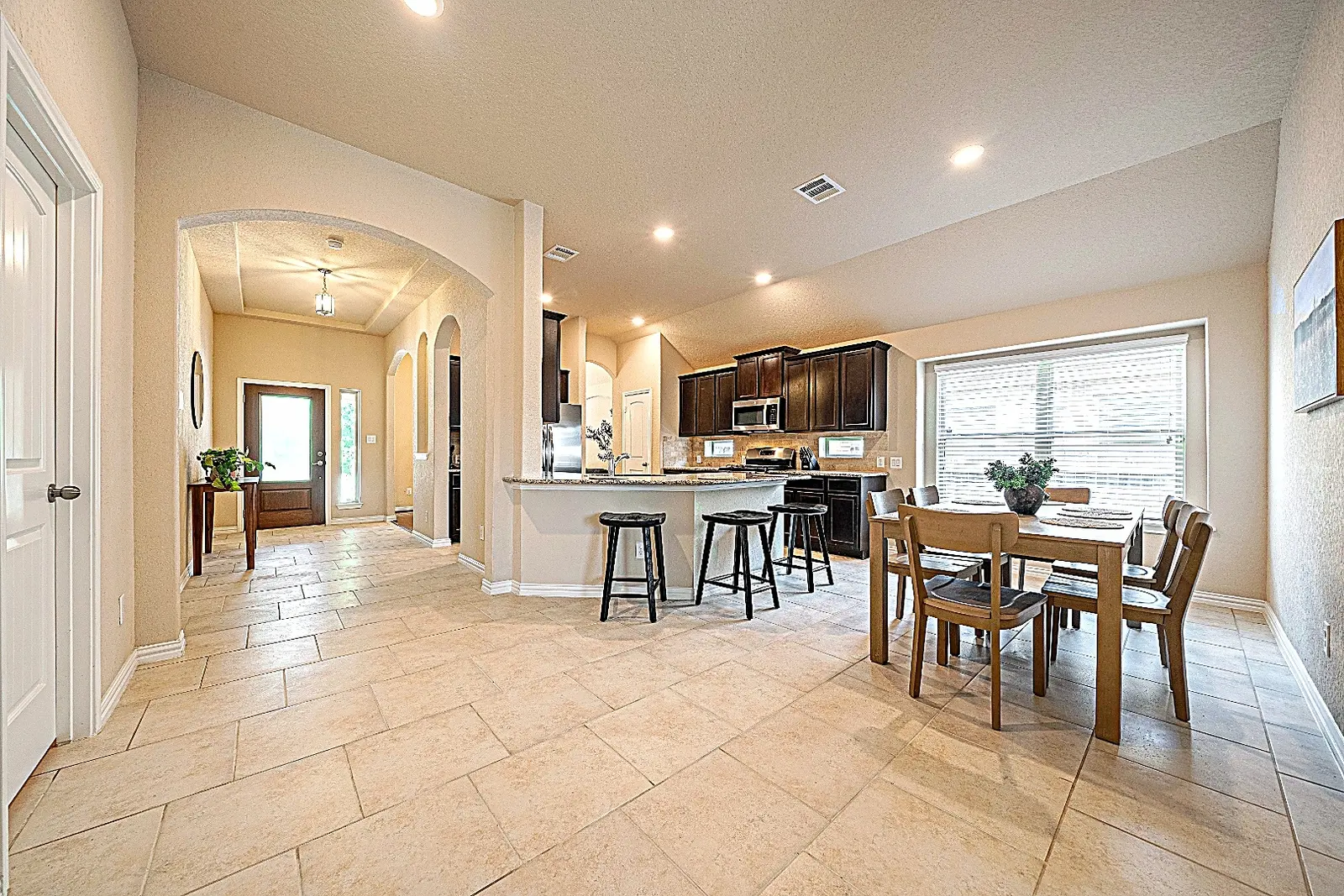 Open kitchen and dining area with breakfast bar at Rawhide Way