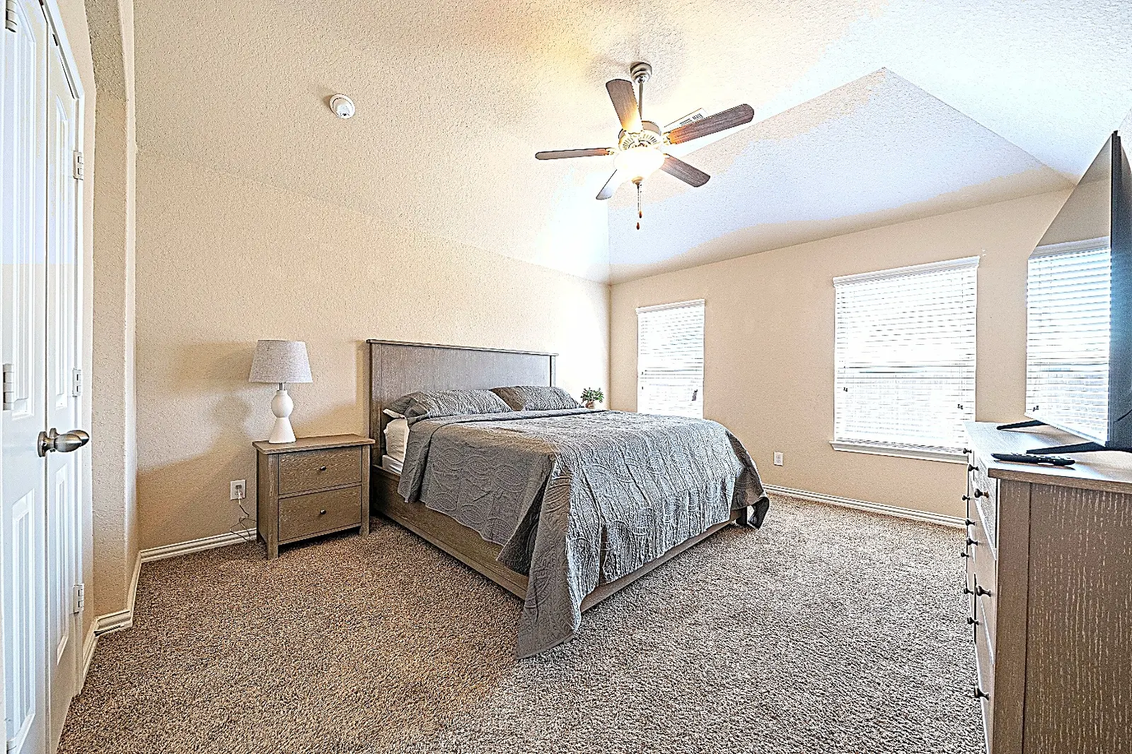 Spacious furnished primary bedroom at Rawhide Way