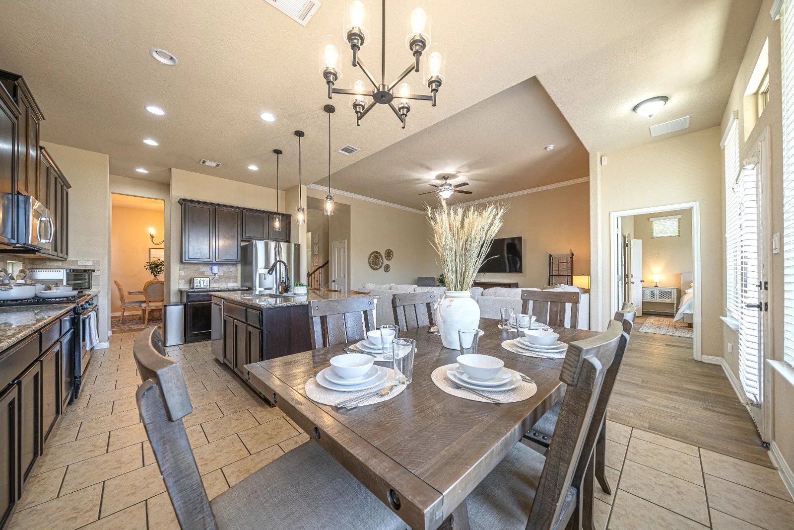 Dining table and open kitchen in the Upton Park furnished home