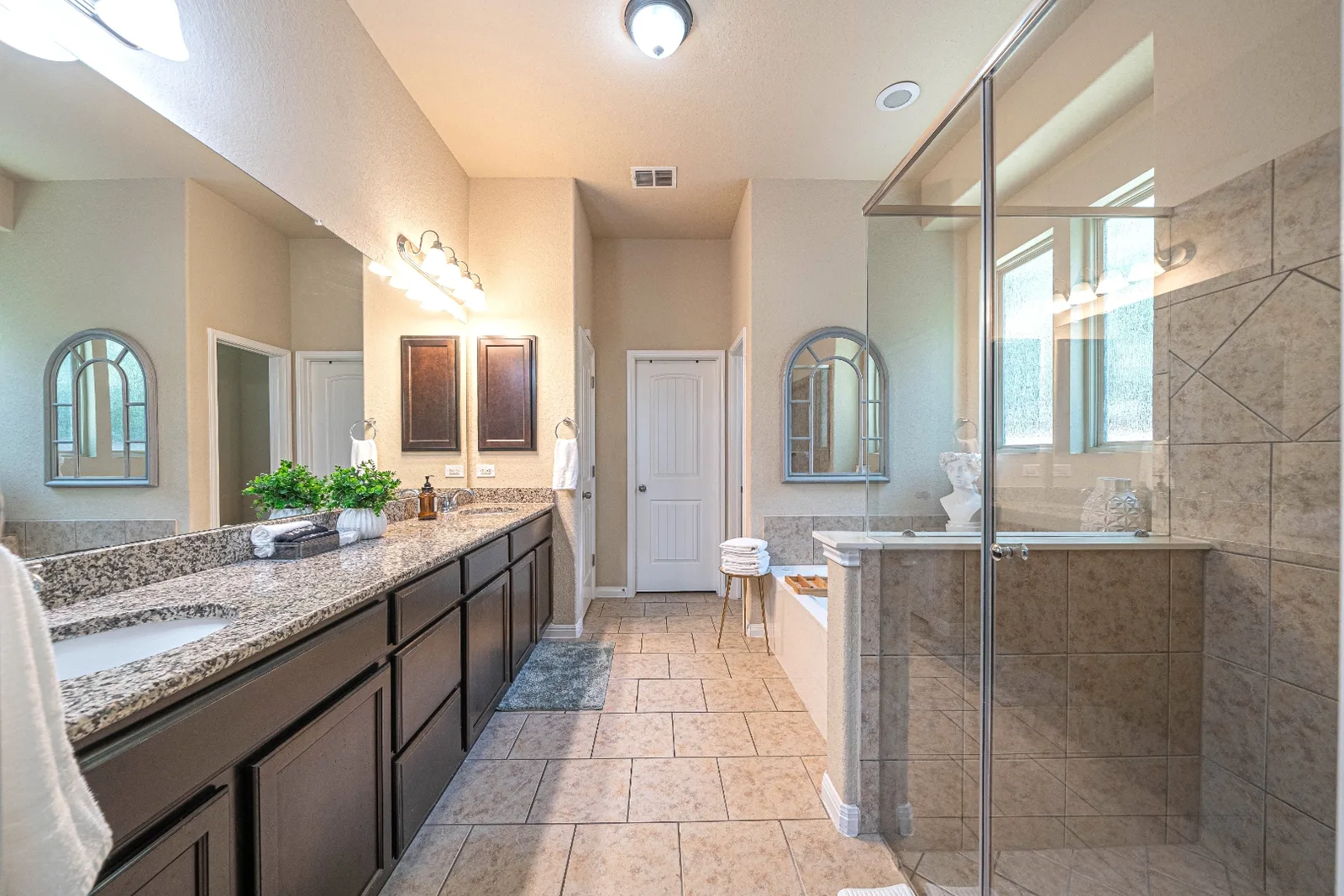 Primary bathroom with dual vanity and walk-in shower at Upton Park